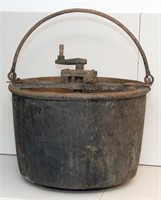 Copper apple butter kettle with wooden stirrer