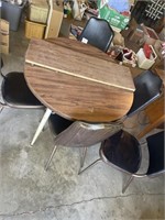 Table with leaf and 5 chairs