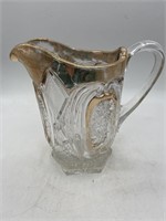 Antique pinwheel star cut glass pitcher with gold