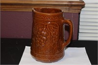 An Antique Majolica Brown Pitcher Pitting