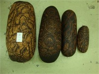 Four unusual carved wooden scoops.