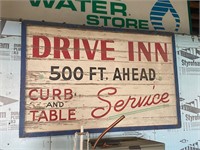 DRIVE INN sign 500' ahead Curb and table Service