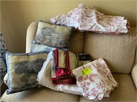 group of pillows, shams and comforter