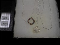 Three sterling necklaces, one is heart-shaped
