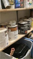 Full shelf of sealer, paint trays