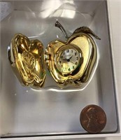 Timex collectible apple clock made of brass.