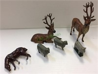 Miniature cast metal animal figures includes