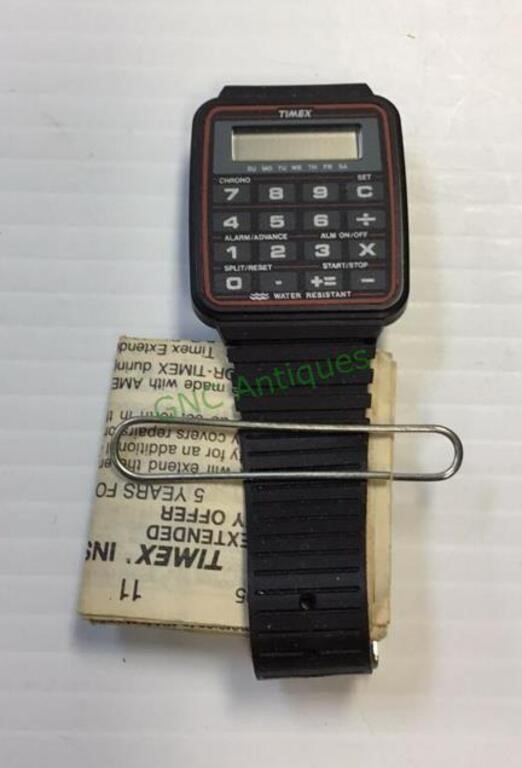Vintage Timex calculator watch with paperwork.