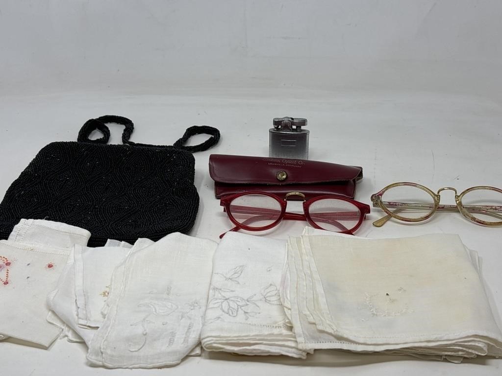 Black beaded purse with three vintage eyeglasses