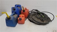 4 gas cans and 2 military fuel bladders