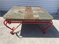 Slate top coffee table with red painted iron base