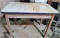 Porcelain topped wood table, legs are wobbly