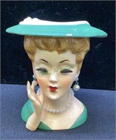Vintage lady head vase with green hat and dress,