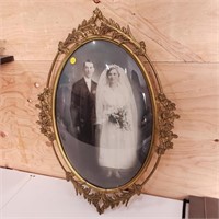 antique brass frame with old photo, convex glass,