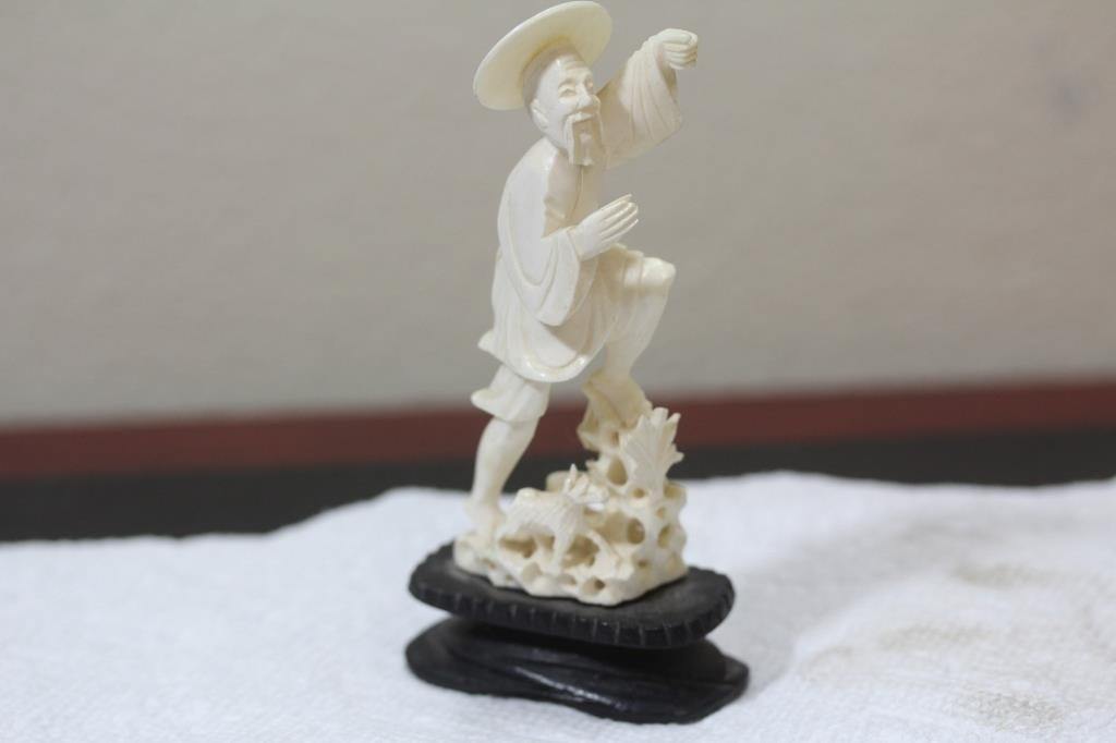 A Chinese Carved Bone Fisherman