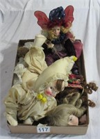 assorted small dolls and doll heads