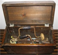 Wood tool box containing vintage tools including