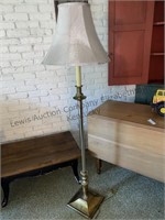 Brass colored metal floor lamp