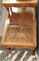 DUAL LEVEL END TABLE WITH INTERIOR CARVINGS