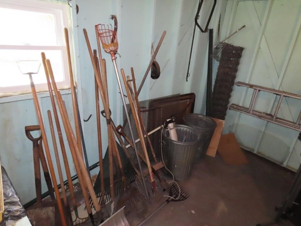 Hand tools, contents along wall.