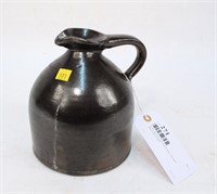 Brown stoneware jug with pour spout with small