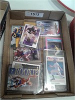 Assorted sports cards in clear sleeves