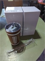 2 football tumblers with metal straws