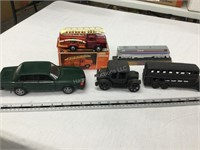 4 vehicles and train