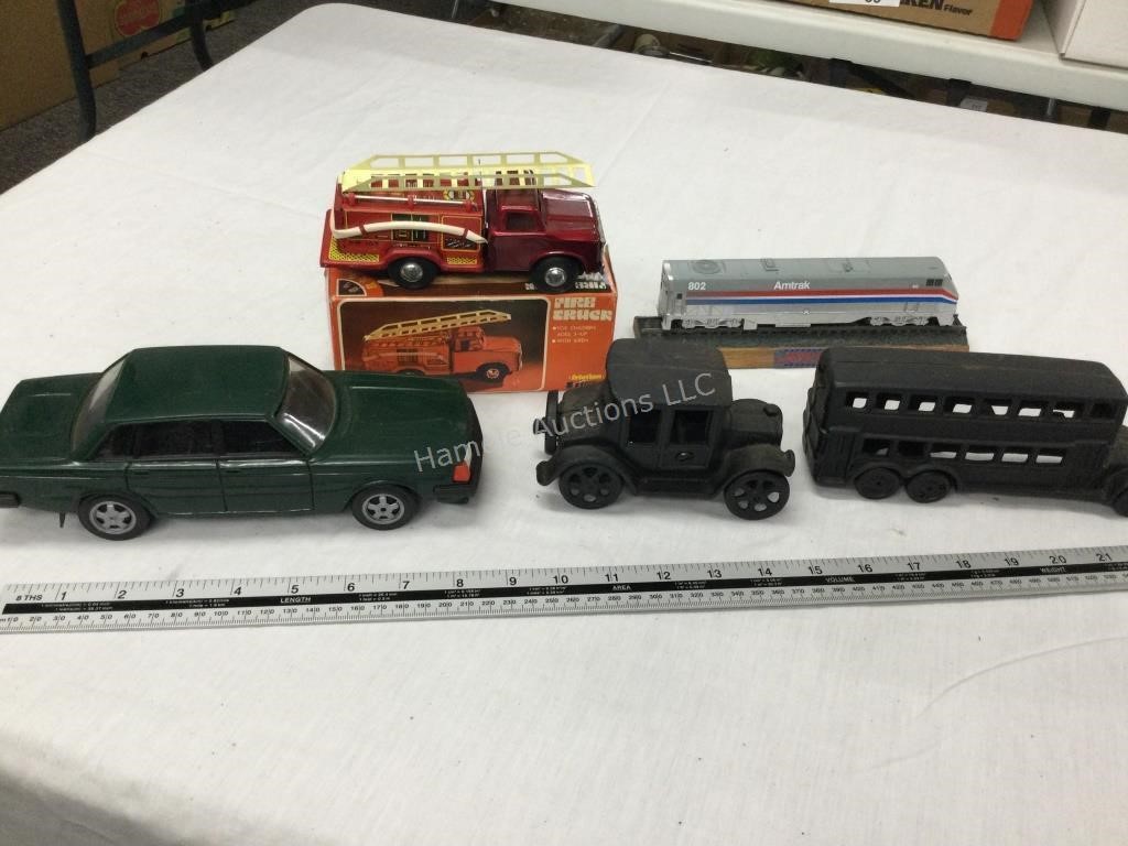 4 vehicles and train
