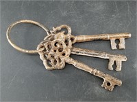 3 Cast iron keys on a ring about 5"