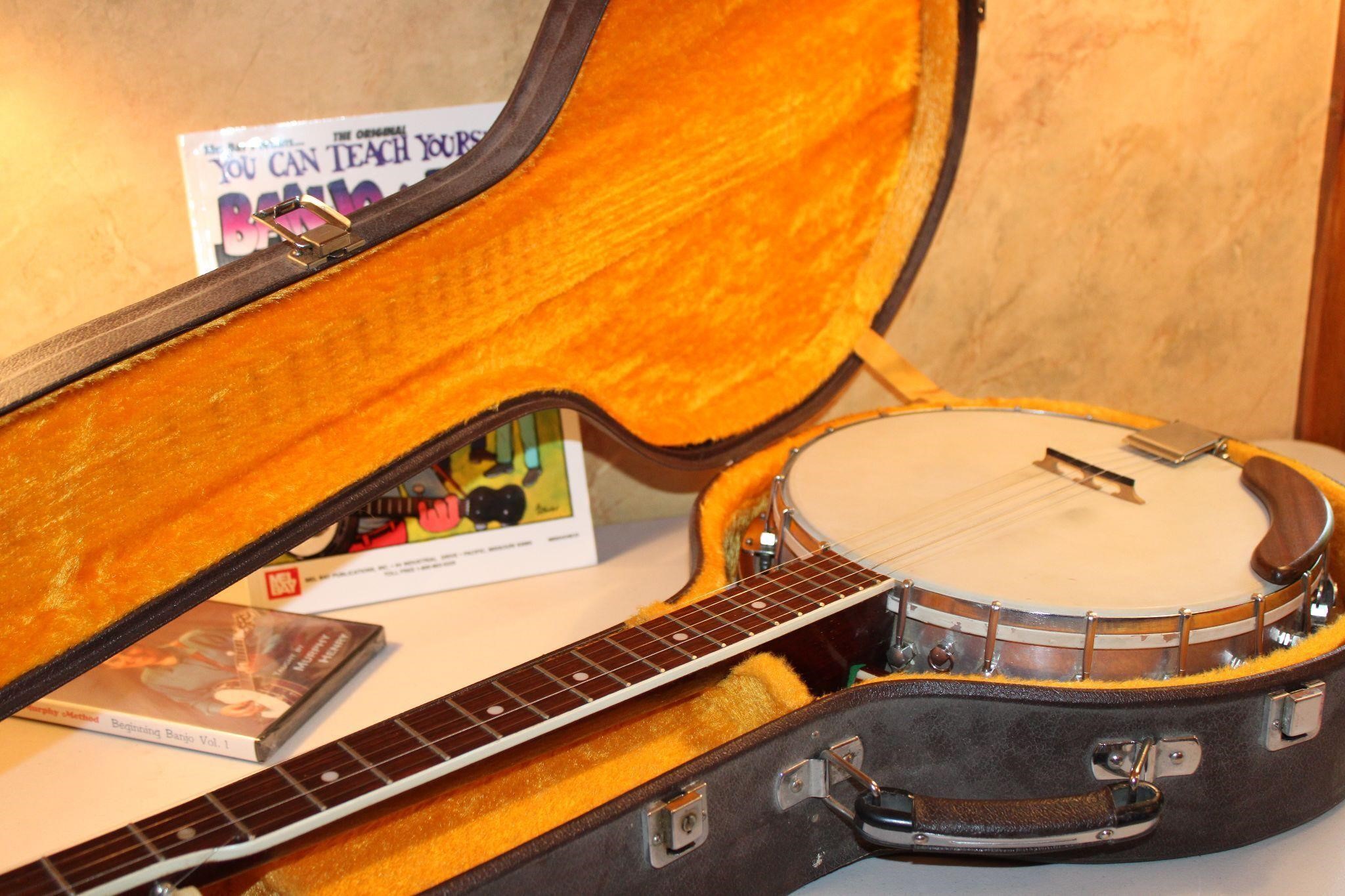 Banjo and instruction book with case