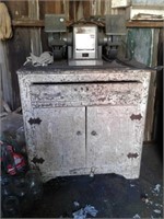 Old cabinet and bench grinder
