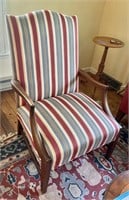 Antique armchair with striped upholstery