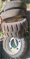 4 like new forklift rims & tires. Tires are solid