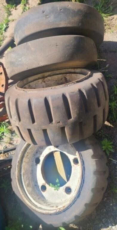 4 like new forklift rims & tires. Tires are solid