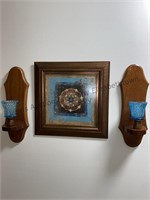Wall grouping includes sconces and picture