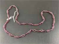 Polished garnet bead necklace with unique beading