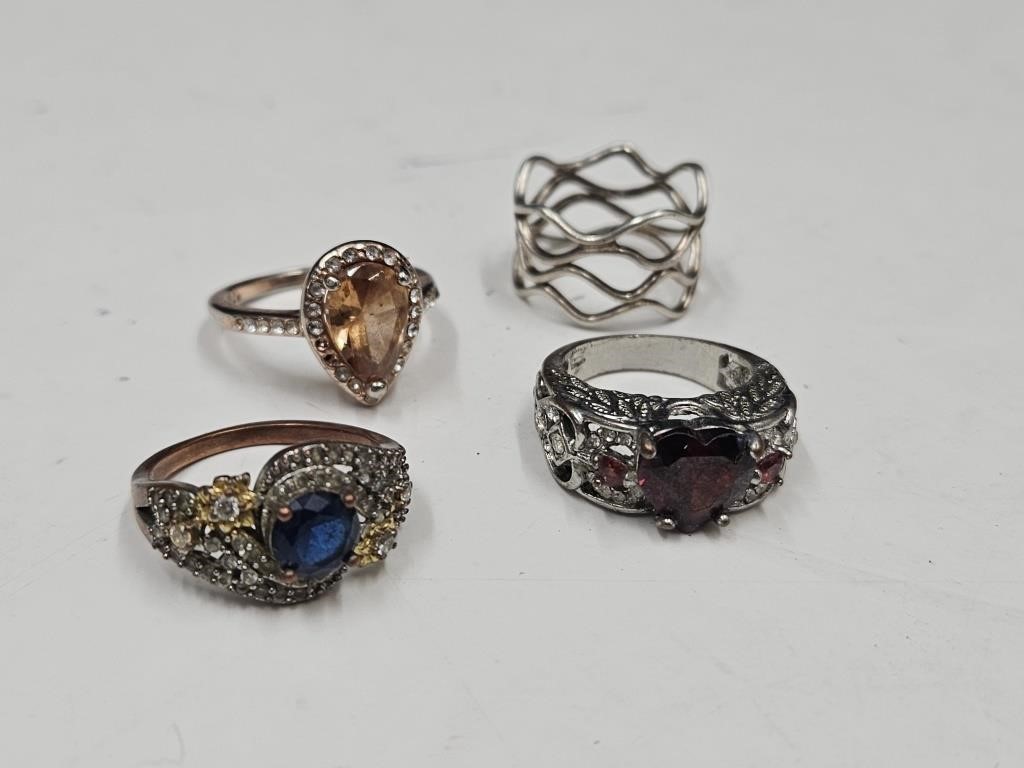 4 Various Size Rings  Marked 925 Silver