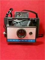 Polaroid Land camera and flash gun