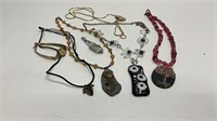 (4) necklaces, (2) rock design pendants, (1)
