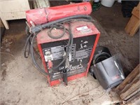 Century 230AMp welder with rods and helmets