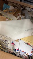 Worldwide Stamps on paper in bankers box has musty