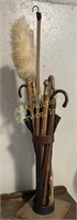 Cane Holder full of Wooden Canes some with Brass,