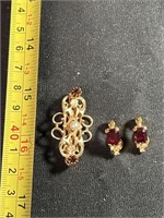 Vintage brooch and Monet earrings, both with red