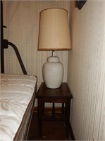 Wood Bench and White Table Lamp
