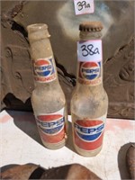 2 vintage glass Pepsi bottles