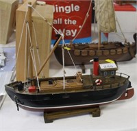 Model fishing boat.