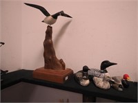 Six fowl figurines, some signed, one is
