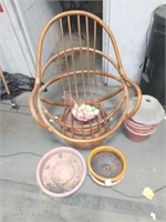 Chair with eggs in a basket, flower pots, and a