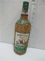 12"vintage, wicker encased tequila bottle
